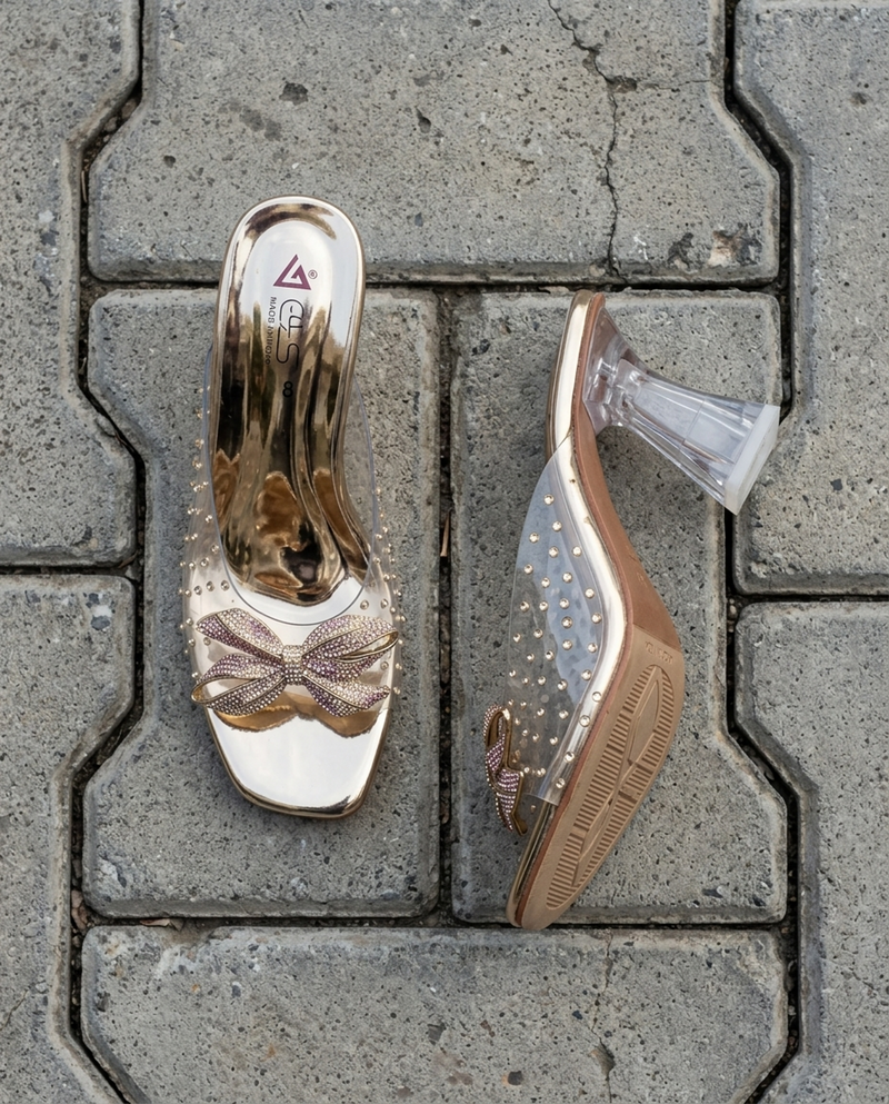 Rhinestone Bow Clear Mule — Gold